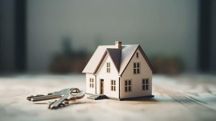 model of a house and key