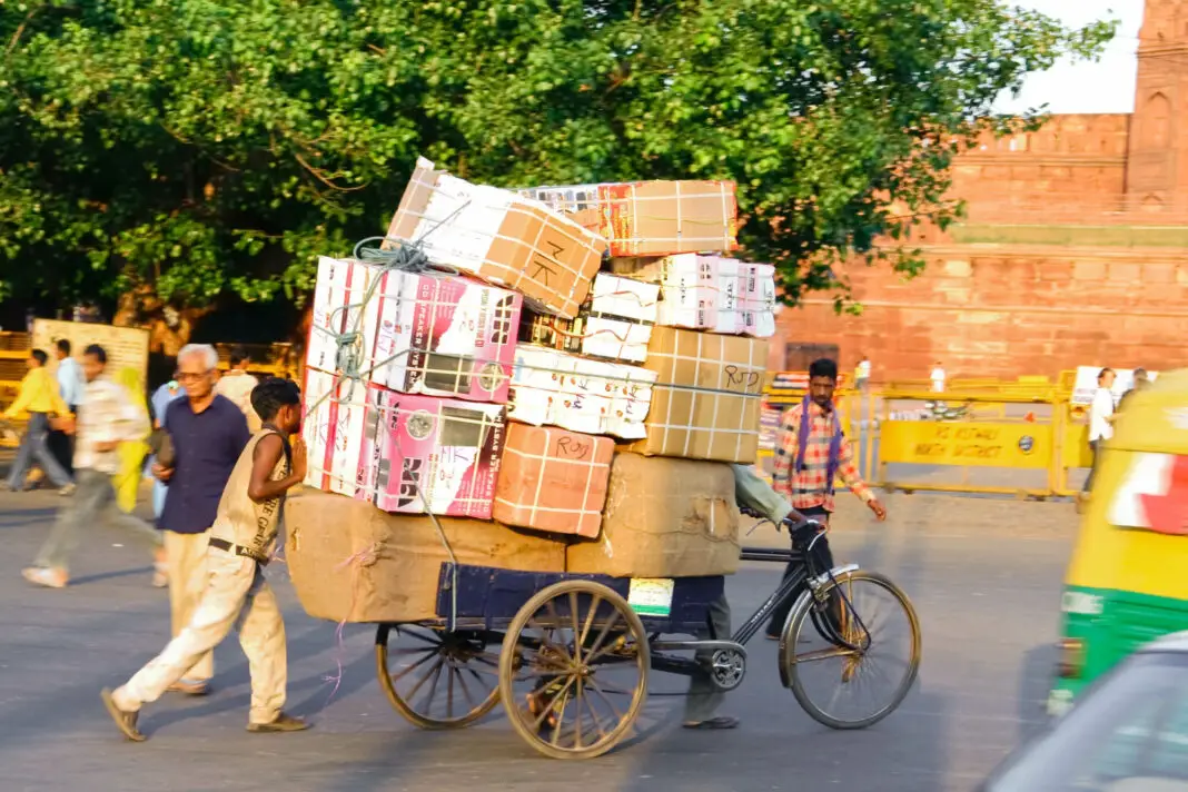 delhi picture of goods being transported by rickshaw