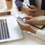 Person explaining something on a phone